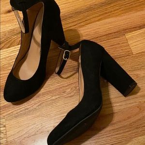 Black heels with ankle strap.